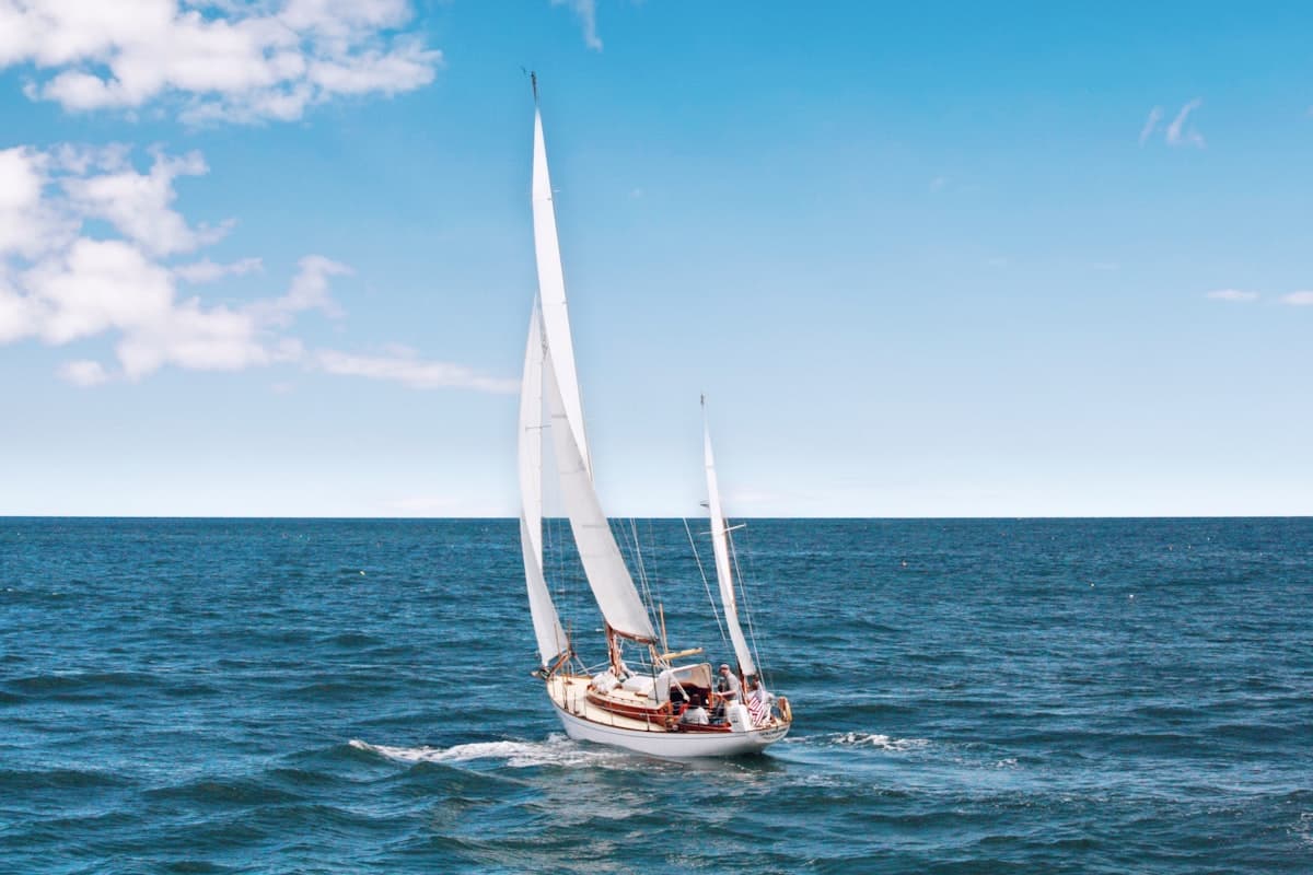 Luxury yacht on open sea during golden hour